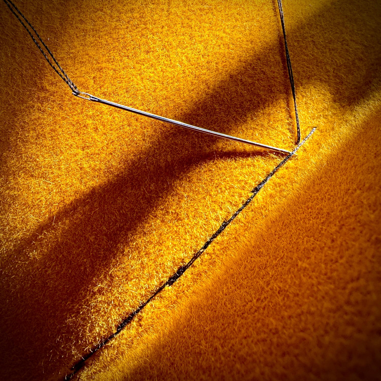 Hand stitched black thread and yellow fedora